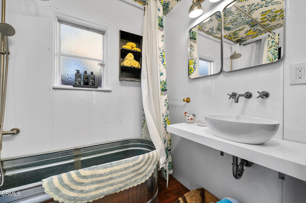 1765 Westhaven Road San Marino, CA 91108 - Photo 27 of 71 a bathroom with a sink a mirror and a toilet