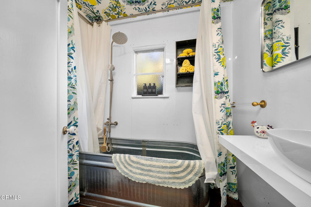 1765 Westhaven Road San Marino, CA 91108 - Photo 28 of 71 a bathroom with a sink and a mirror