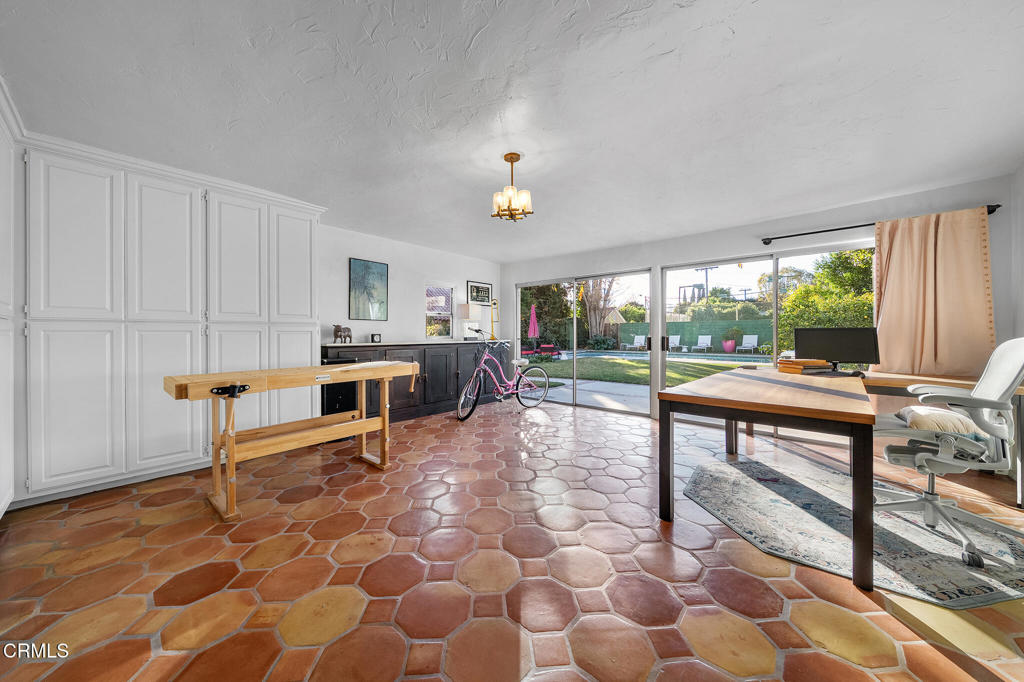 1765 Westhaven Road San Marino, CA 91108 - Photo 29 of 71 a living room with furniture a fireplace and a table