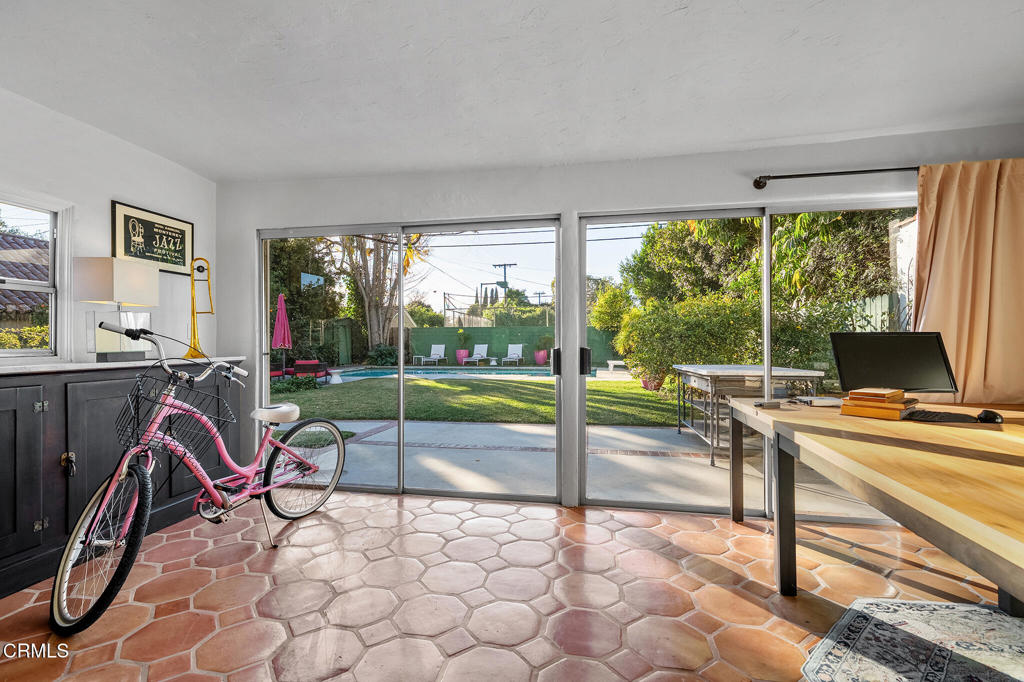 1765 Westhaven Road San Marino, CA 91108 - Photo 31 of 71 a view of a patio with a table chairs and a floor to ceiling window