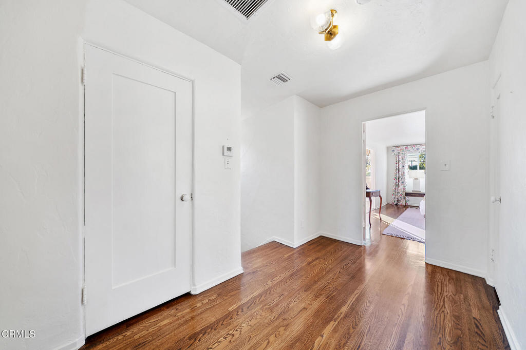 1765 Westhaven Road San Marino, CA 91108 - Photo 49 of 71 a view of a hallway with wooden floor closet and living room