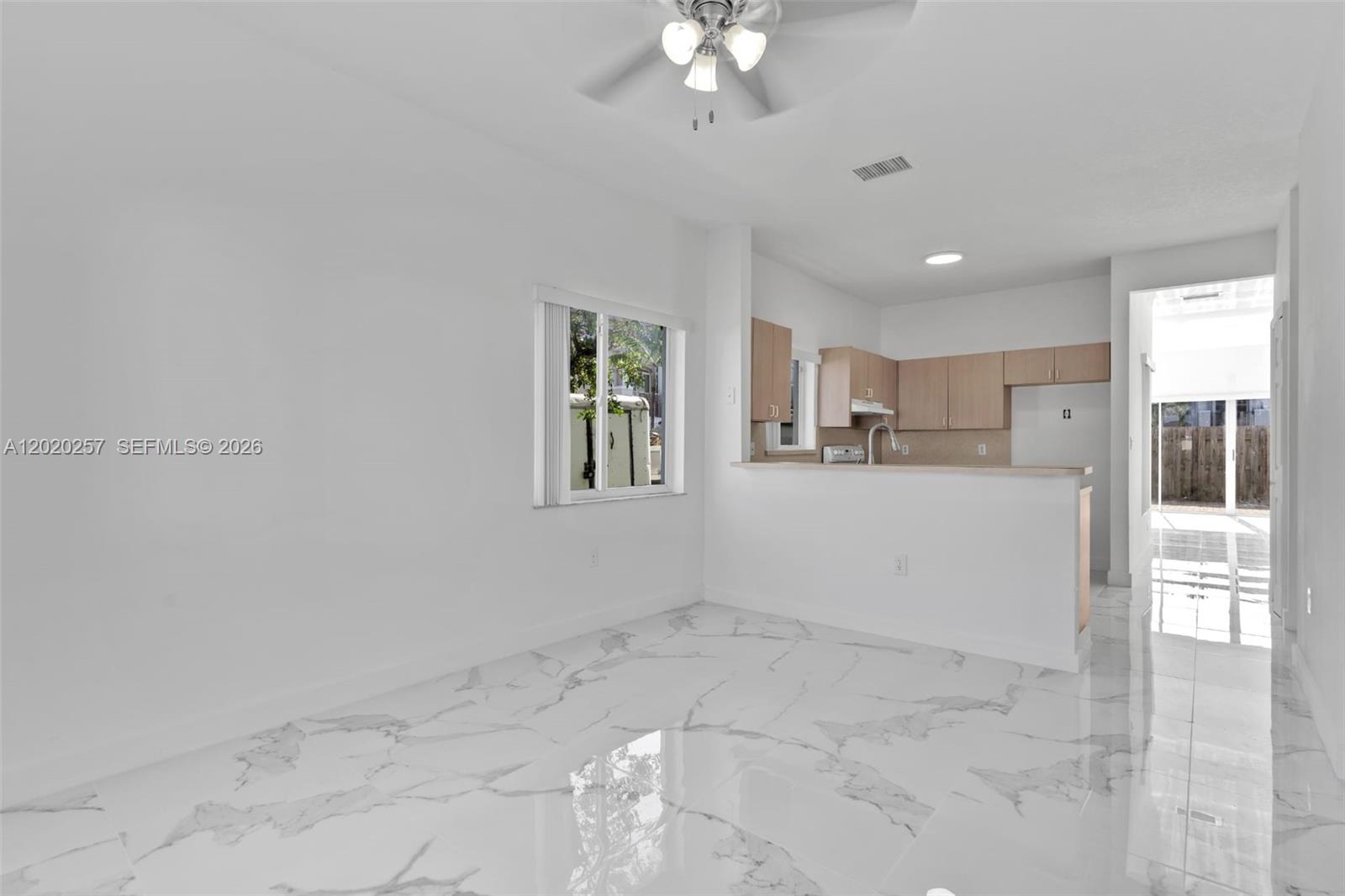 10245 Southwest 154th Place, Unit 1123 Miami, FL 33196 - Photo 11 of 38 a view of kitchen with center island and stainless steel appliances