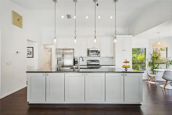 a view of a living room and hardwood floor