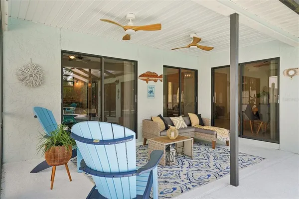 a view of a tables and chairs in patio