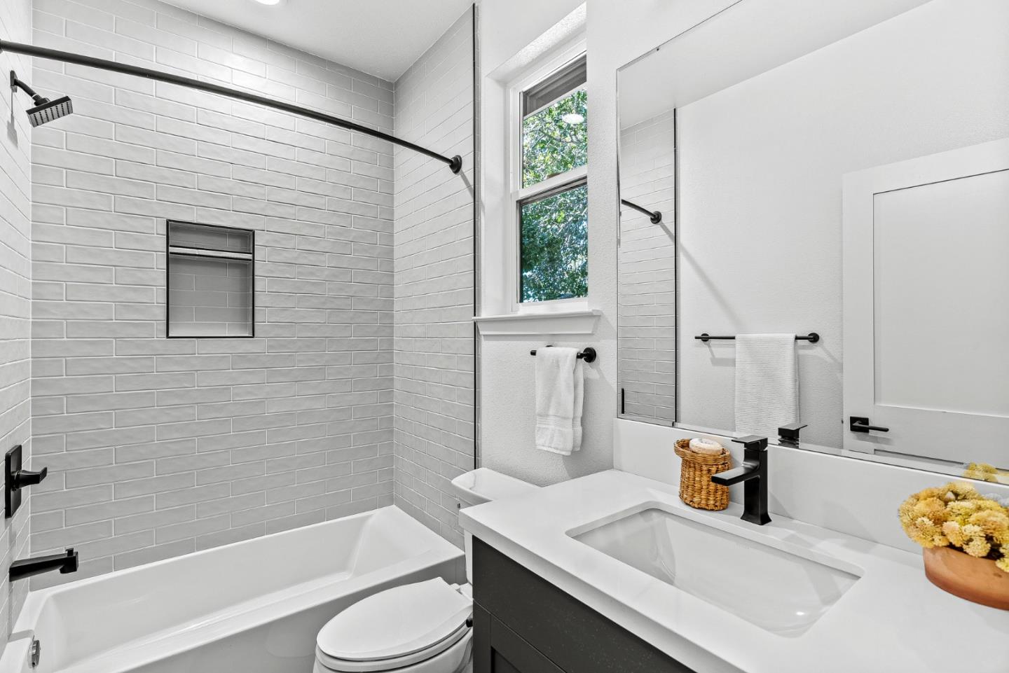 943 Woodside Road Redwood City, CA 94061 - Photo 18 of 19 a bathroom with a sink toilet and shower