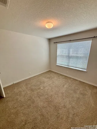 an empty room with a empty space and window