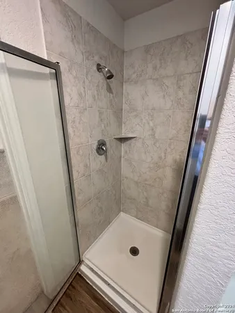 a bathroom with a tub and a shower