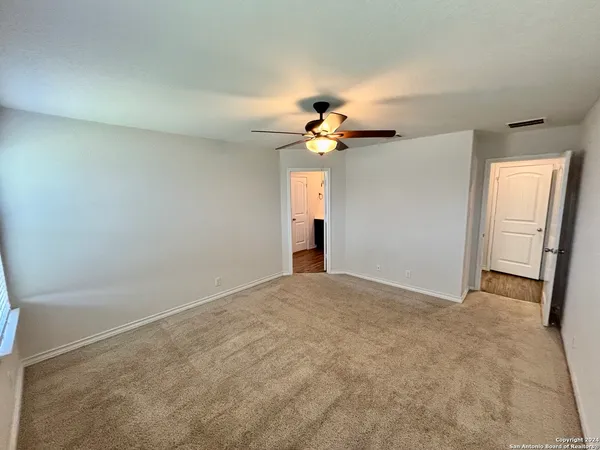 an empty room with a bathroom