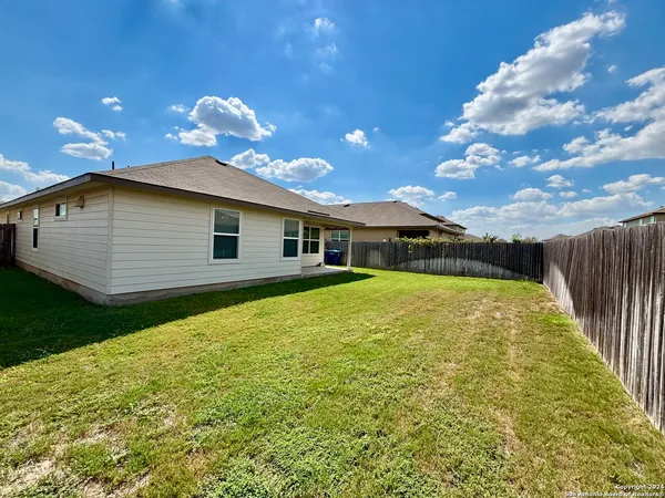 a backyard of a house with lots of green space
