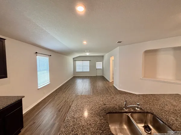 a kitchen with a sink and a refrigerator