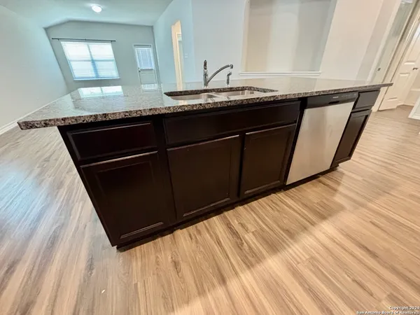 a bathroom with a sink a mirror and vanity