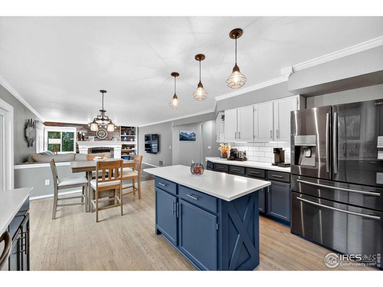 9910 Ashleigh Way Highlands Ranch, CO 80126 - Photo 12 of 45 a kitchen with kitchen island a sink stove and refrigerator