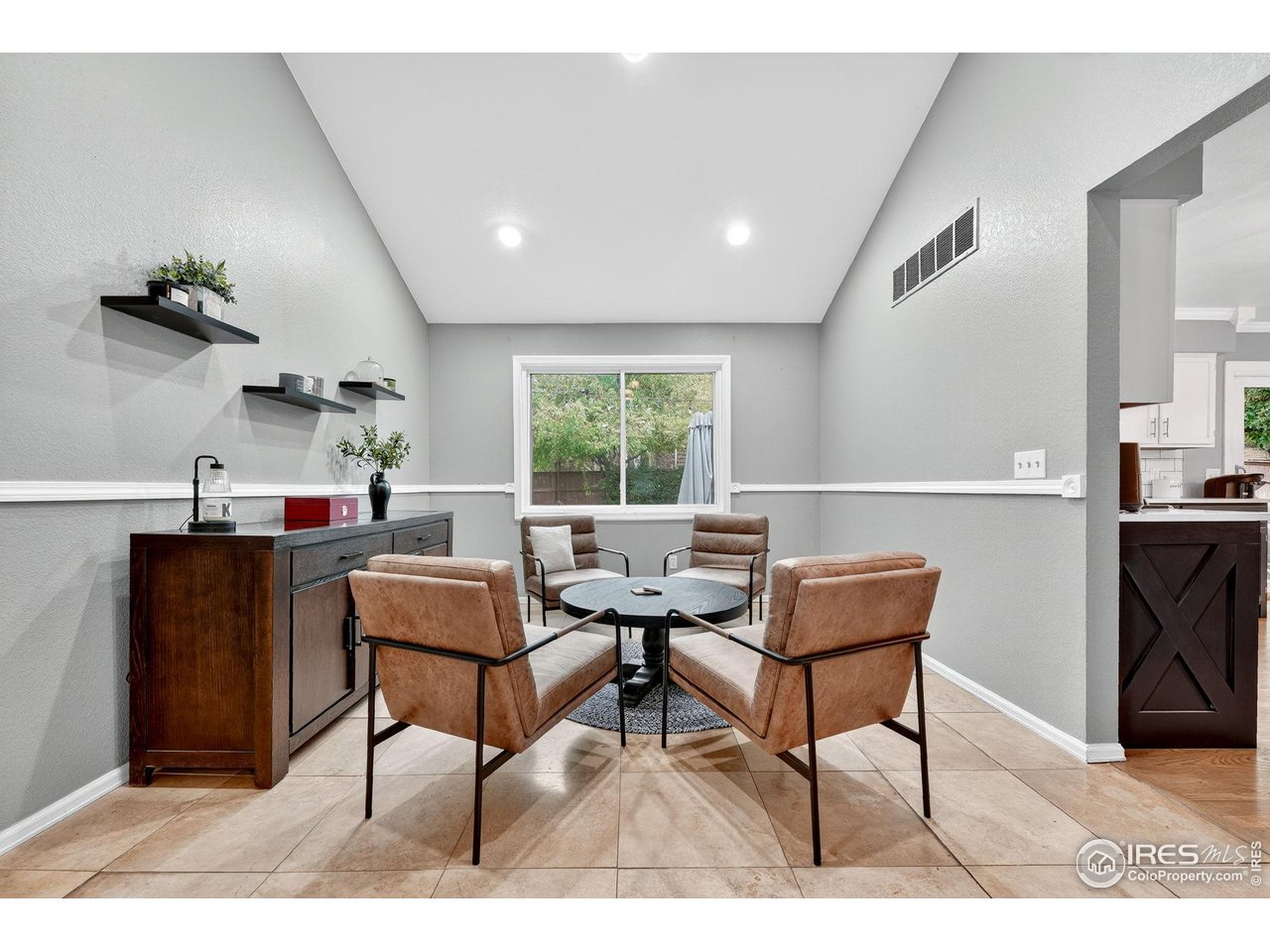9910 Ashleigh Way Highlands Ranch, CO 80126 - Photo 16 of 45 a living room with furniture and a window