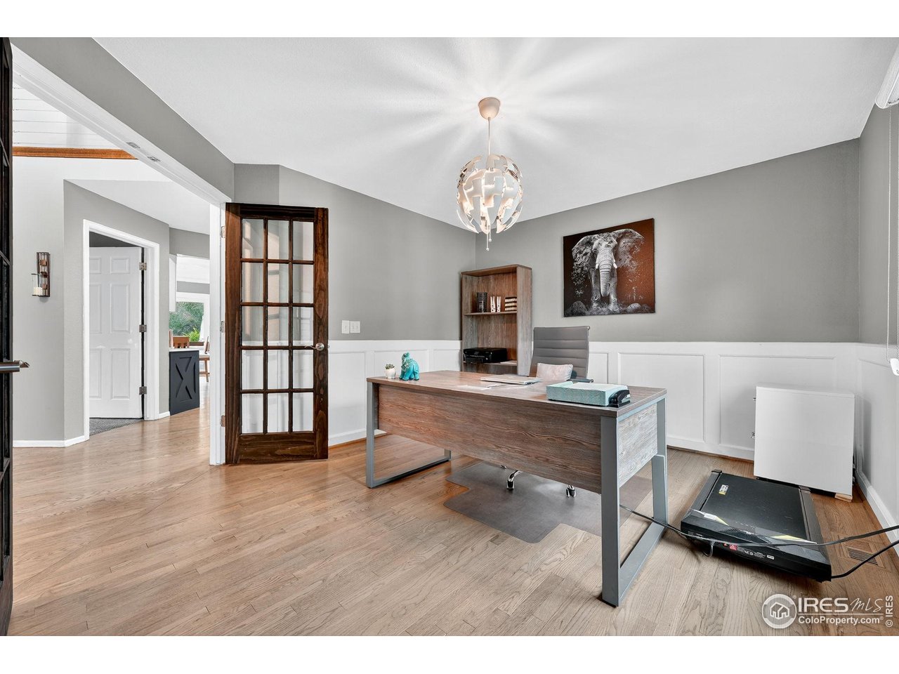 9910 Ashleigh Way Highlands Ranch, CO 80126 - Photo 17 of 45 a living room with furniture and a wooden floor