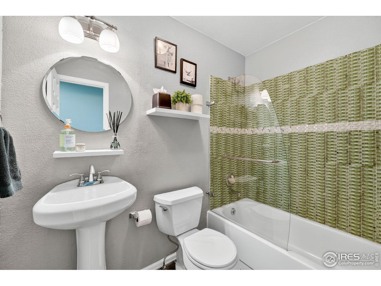 9910 Ashleigh Way Highlands Ranch, CO 80126 - Photo 19 of 45 a bathroom with a sink toilet and shower