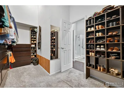 a en suite bathroom with a double vanity sink a mirror and a