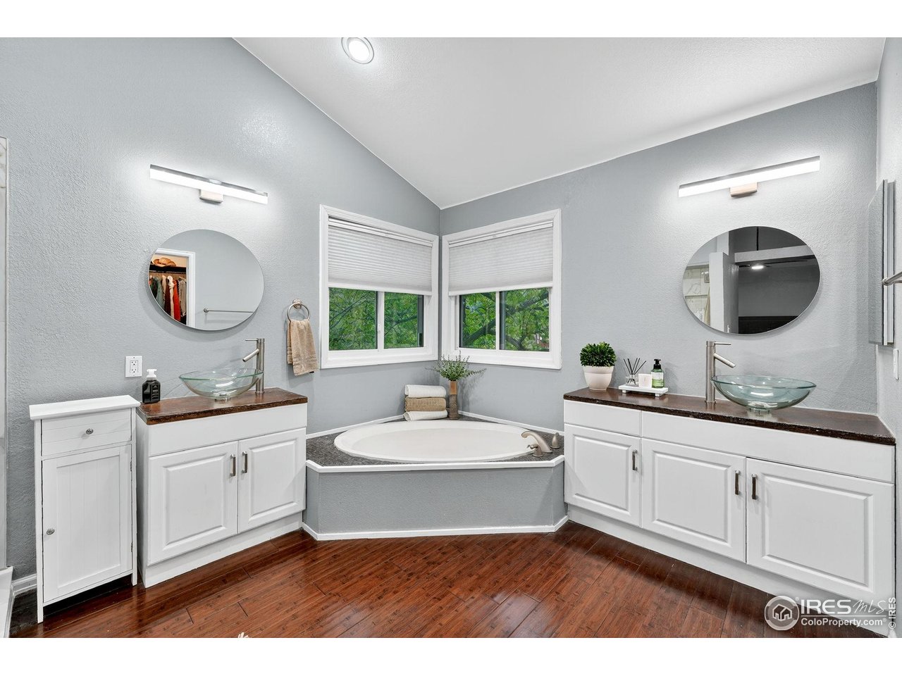9910 Ashleigh Way Highlands Ranch, CO 80126 - Photo 23 of 45 a en suite bathroom with a double vanity sink a mirror and a