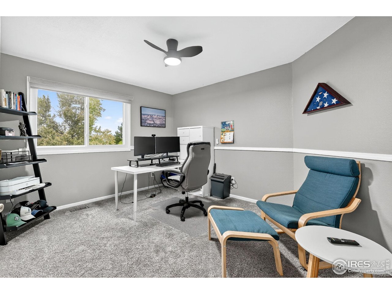 9910 Ashleigh Way Highlands Ranch, CO 80126 - Photo 25 of 45 a workspace with a desk chair and painted walls