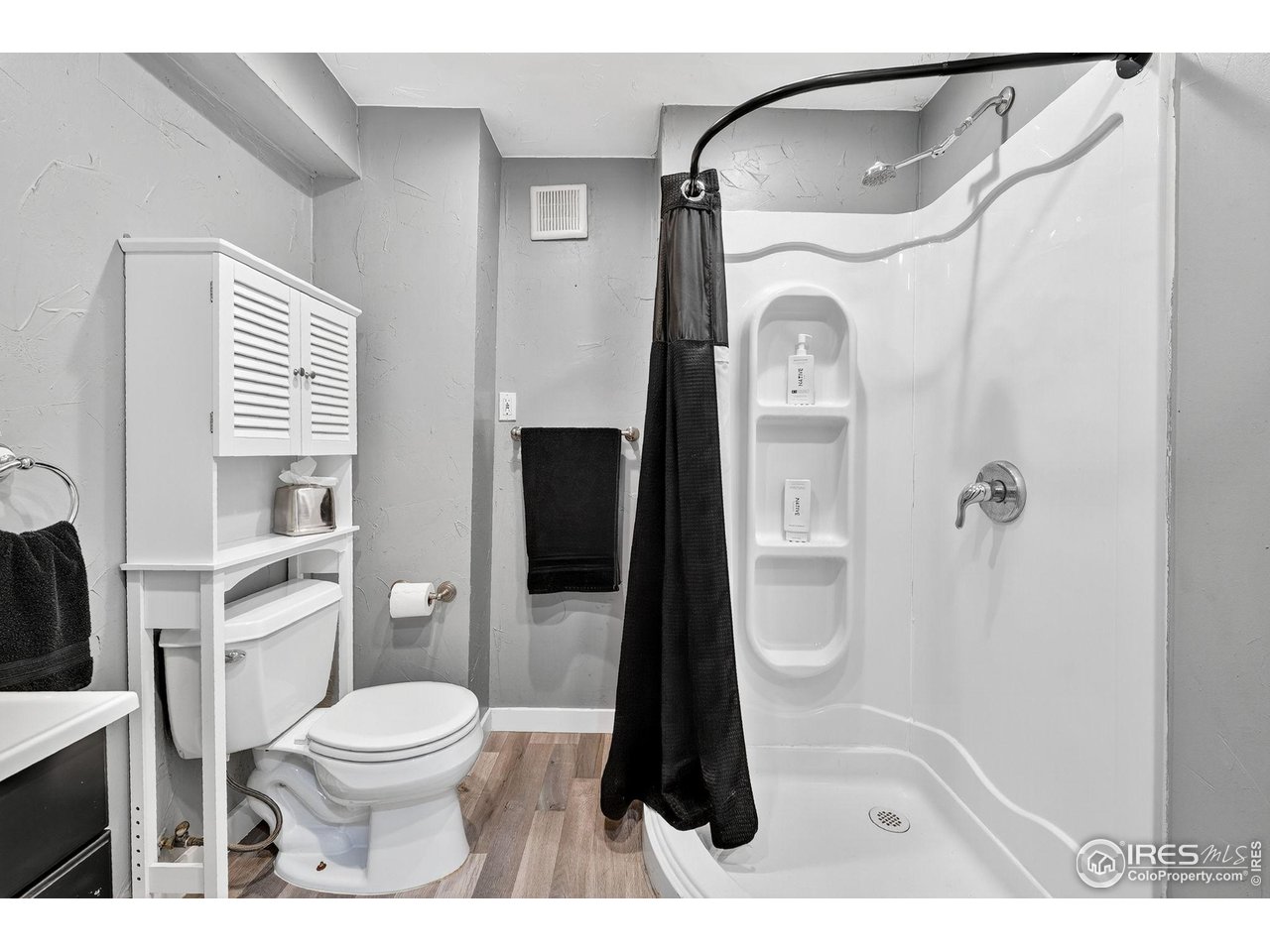 9910 Ashleigh Way Highlands Ranch, CO 80126 - Photo 32 of 45 a bathroom with a toilet a sink and shower