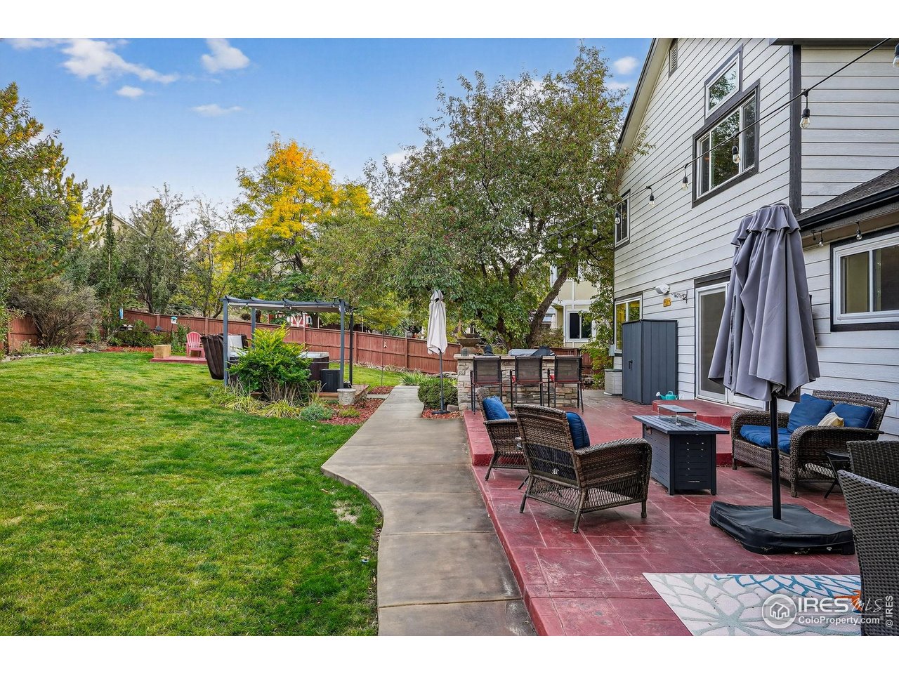 9910 Ashleigh Way Highlands Ranch, CO 80126 - Photo 37 of 45 a view of a house with backyard sitting area and garden