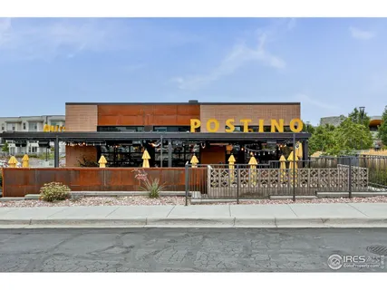 a front view of a building with parking