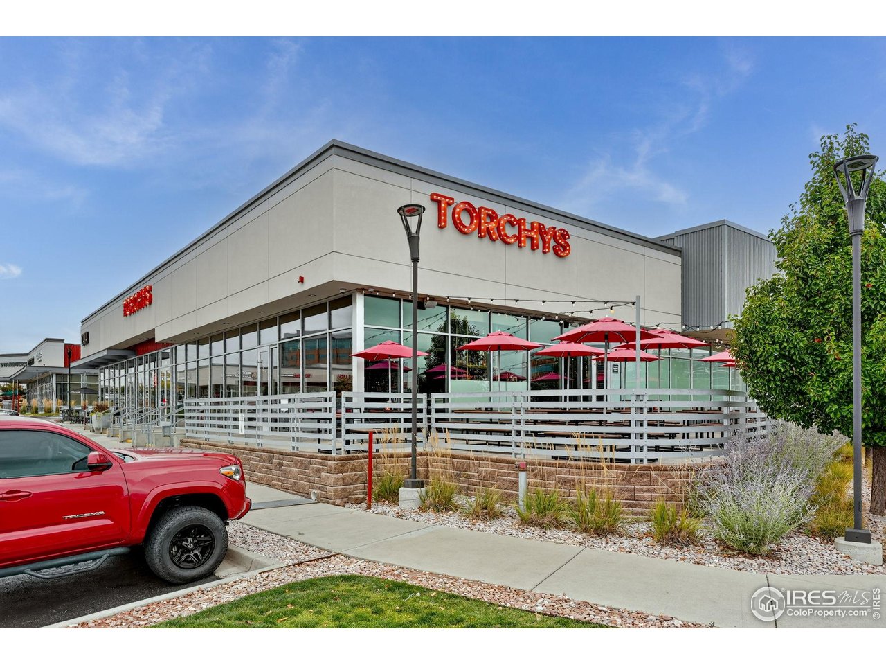 9910 Ashleigh Way Highlands Ranch, CO 80126 - Photo 44 of 45 a front view of a building with parking