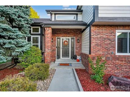 a view of a pathway with flower pots