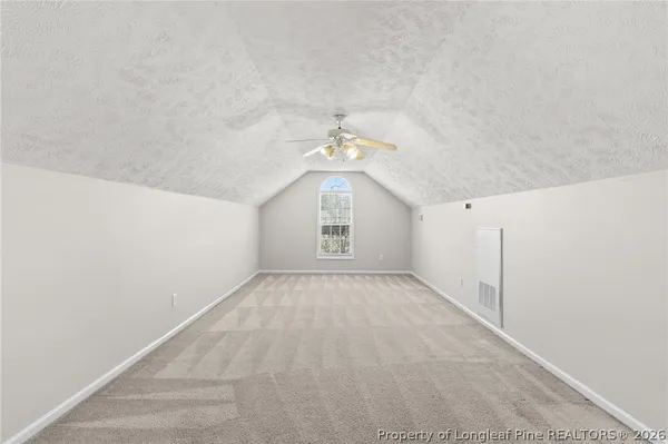 a view of an empty room and a window