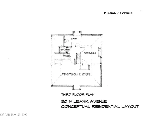 a view of a white house next to a white wall