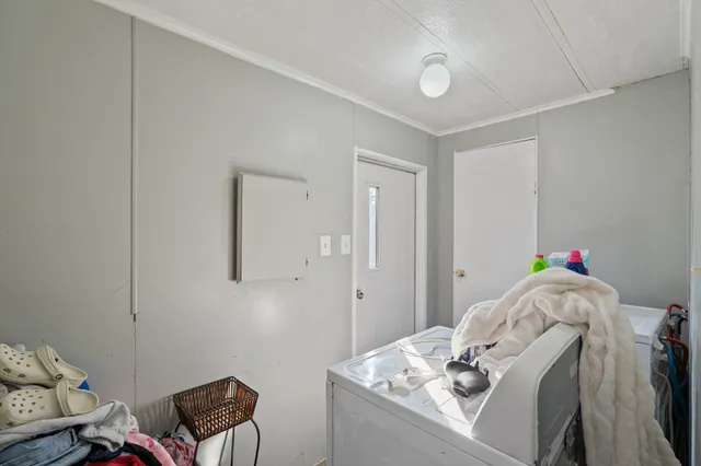 a view of yard with swimming pool and green space