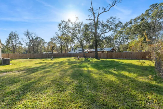 a view of a house with a big yard