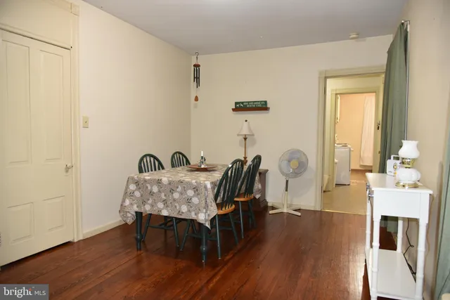 a view of a livingroom with furniture and wooden floor
