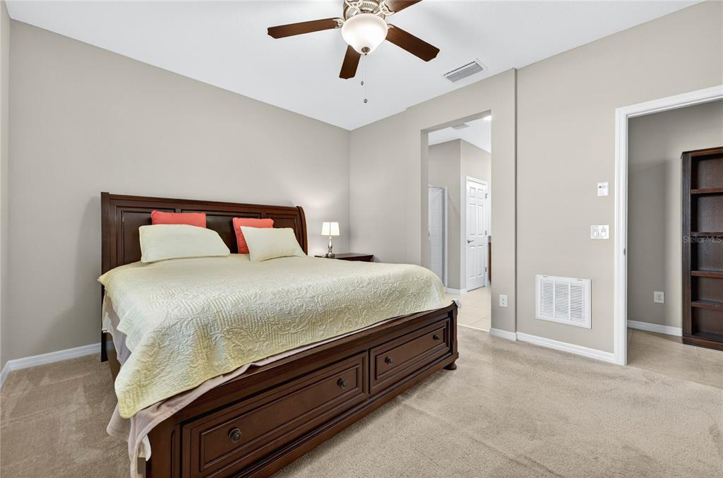 3947 Northwest 46th Ter. Ocala, FL 34482 - Photo 20 of 75 a bedroom with a bed and a chandelier