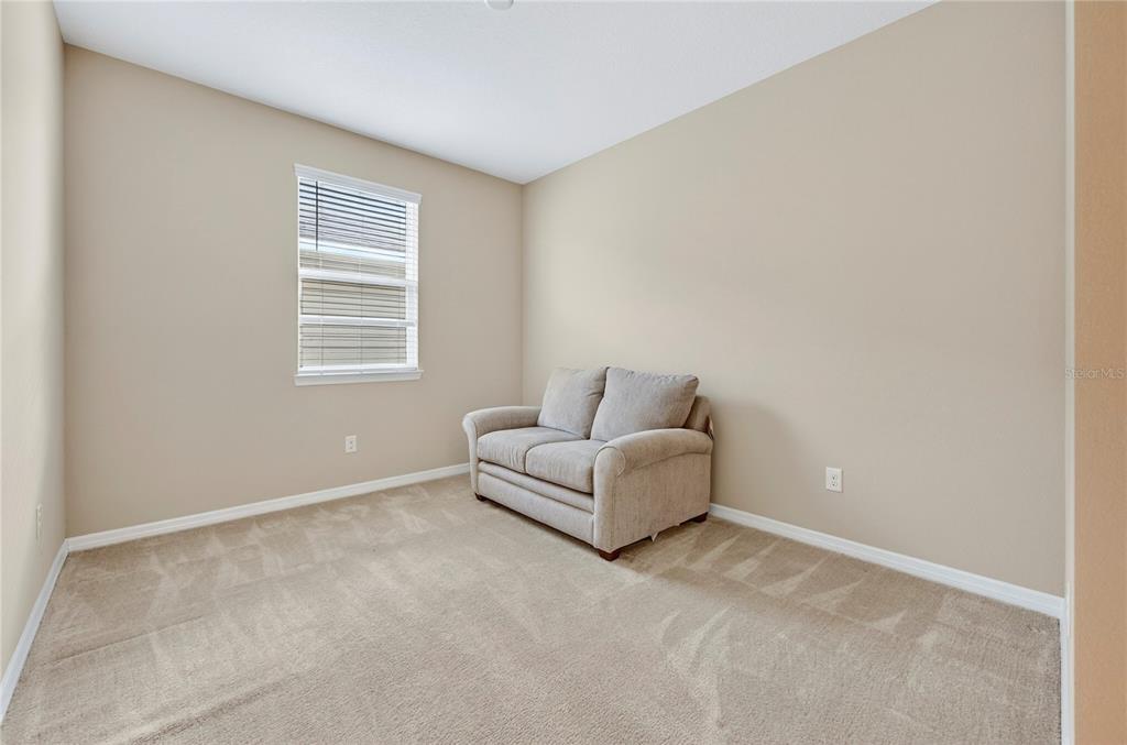 3947 Northwest 46th Ter. Ocala, FL 34482 - Photo 27 of 75 a living room with furniture and a window