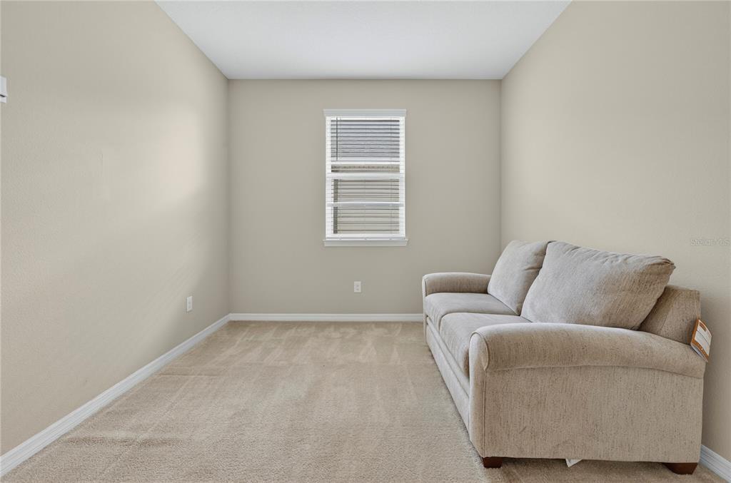 3947 Northwest 46th Ter. Ocala, FL 34482 - Photo 28 of 75 a living room with furniture and a window