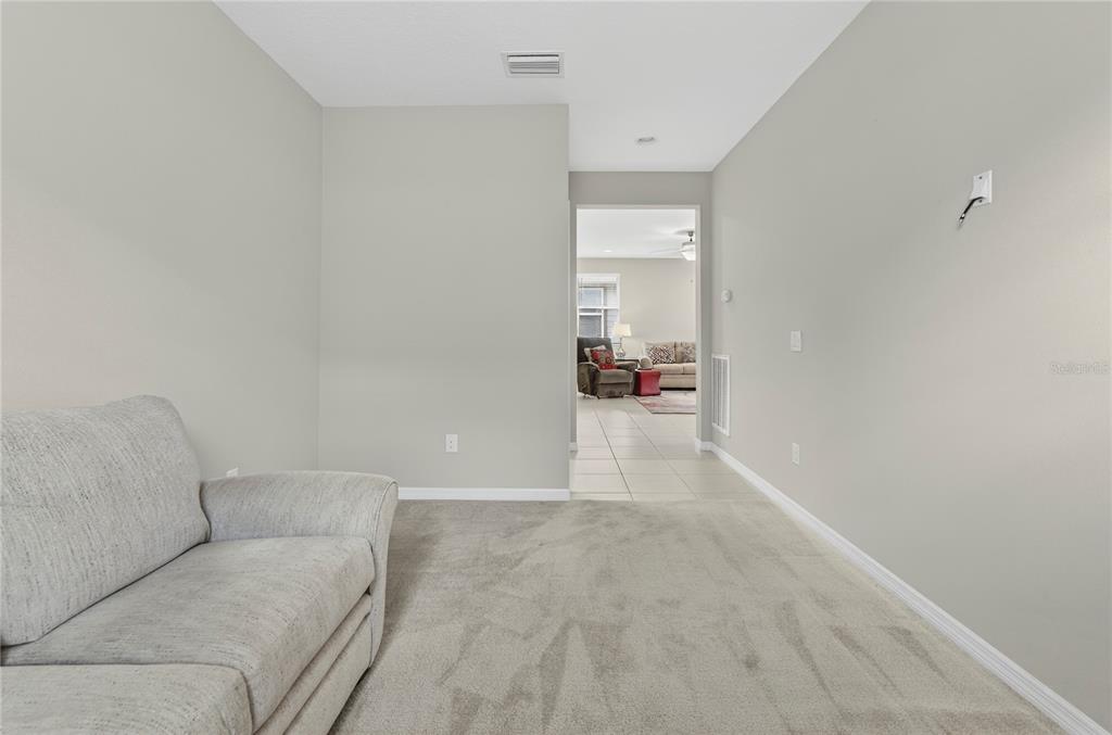 3947 Northwest 46th Ter. Ocala, FL 34482 - Photo 30 of 75 a living room with furniture and a wooden floor