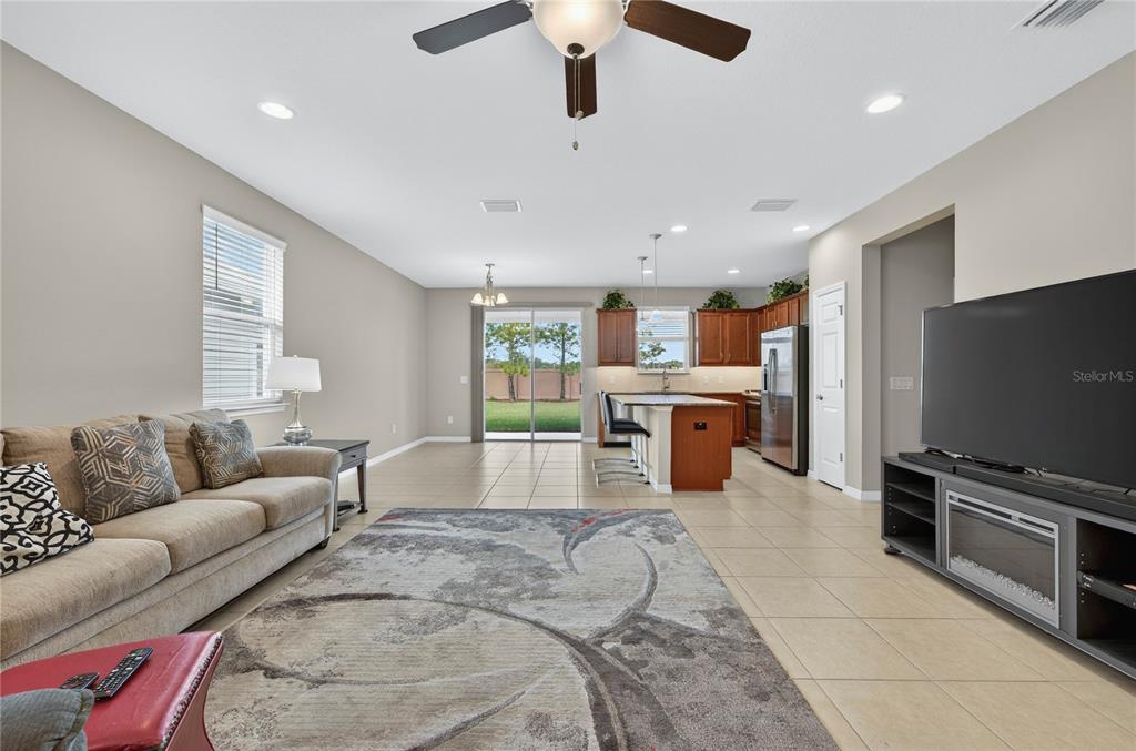 3947 Northwest 46th Ter. Ocala, FL 34482 - Photo 4 of 75 a living room with furniture and a flat screen tv