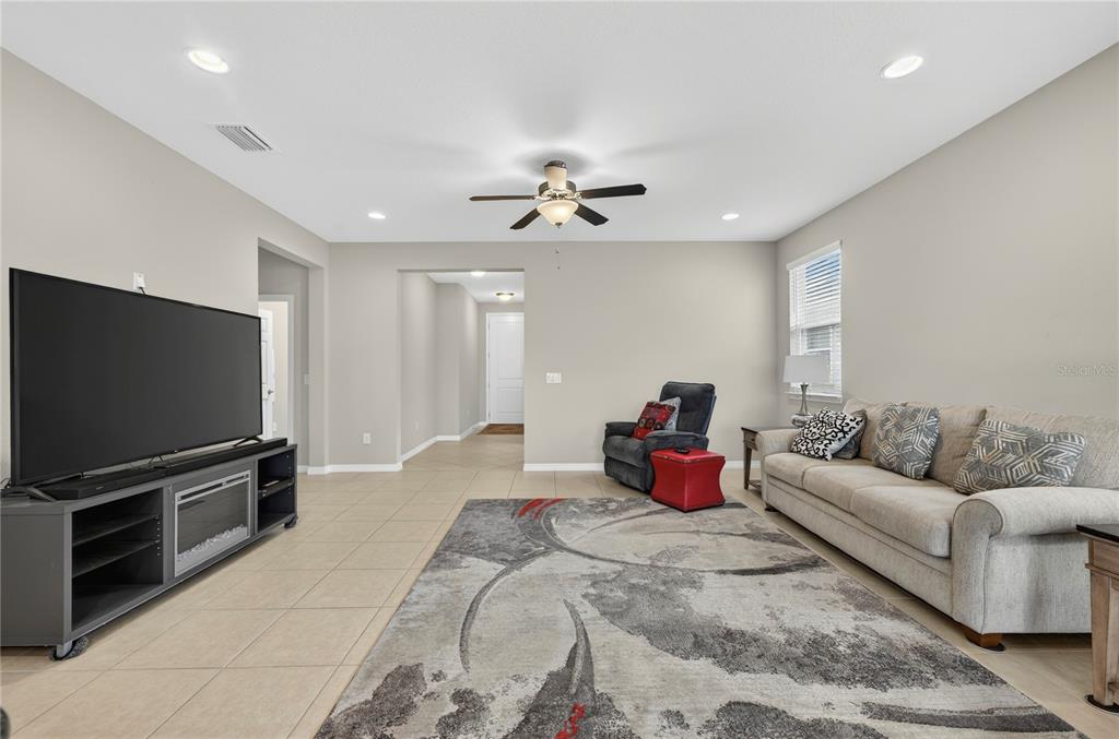 3947 Northwest 46th Ter. Ocala, FL 34482 - Photo 7 of 75 a bedroom with furniture and a flat screen tv