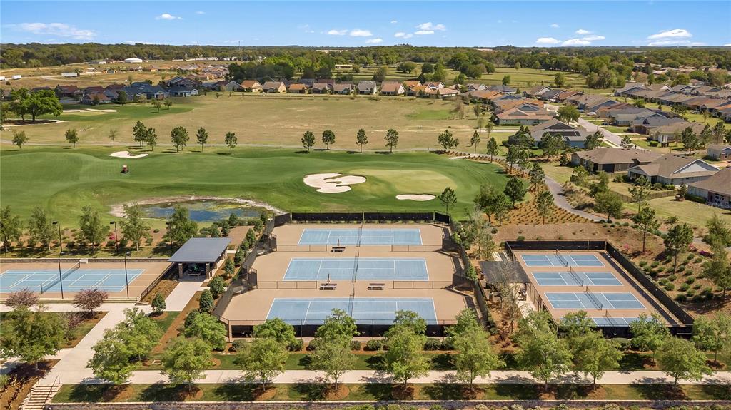 3947 Northwest 46th Ter. Ocala, FL 34482 - Photo 72 of 75 an aerial view of a building with outdoor space swimming pool and lake view