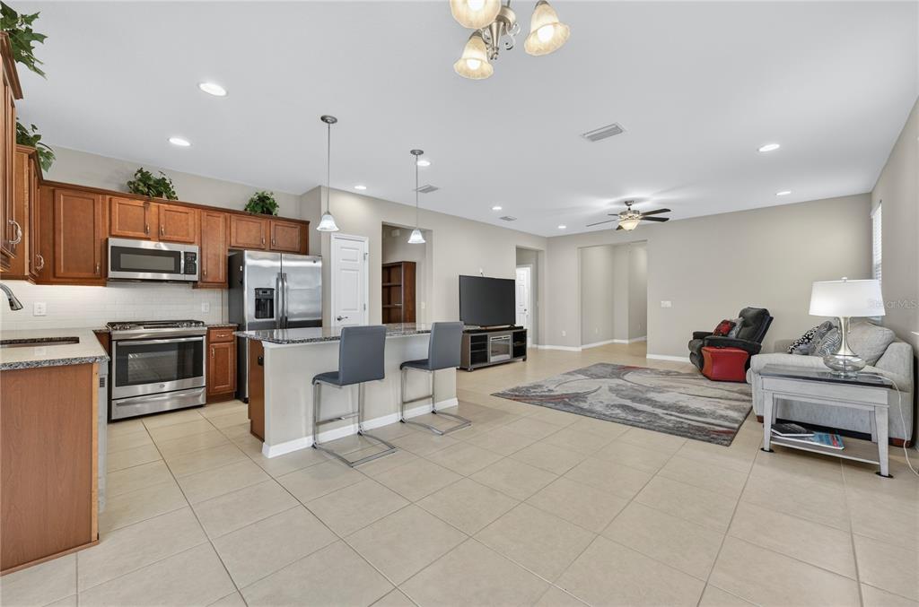 3947 Northwest 46th Ter. Ocala, FL 34482 - Photo 9 of 75 a living room with furniture and kitchen appliances