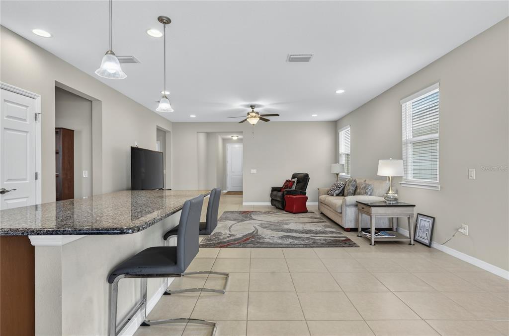 3947 Northwest 46th Ter. Ocala, FL 34482 - Photo 10 of 75 a living room with furniture and a chandelier
