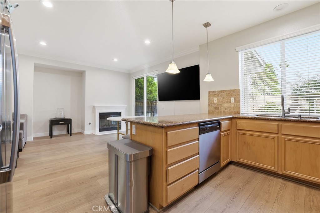 8220 Chamberlain Reseda, CA 91335 - Photo 12 of 46 a kitchen with stainless steel appliances granite countertop a sink and a stove with wooden floor