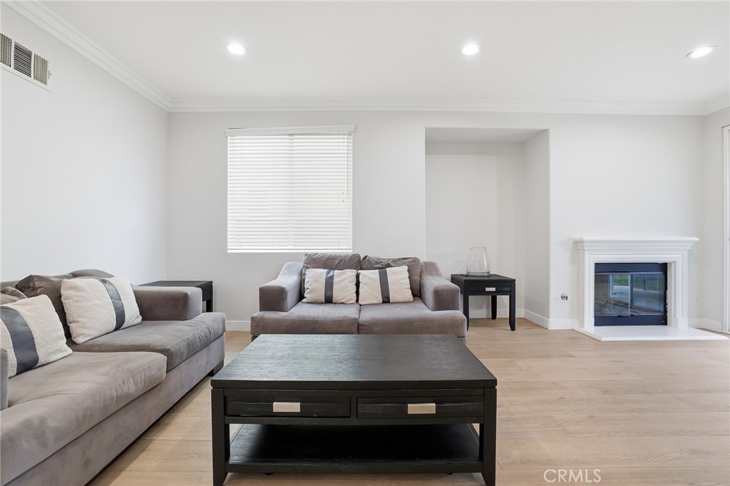 8220 Chamberlain Reseda, CA 91335 - Photo 14 of 46 a living room with furniture and a fireplace