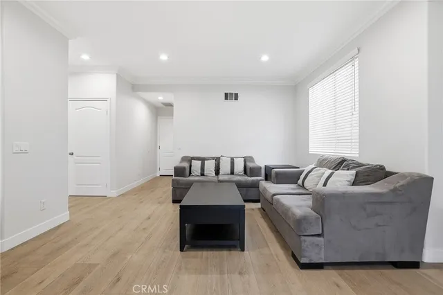 a kitchen with stainless steel appliances granite countertop a stove a refrigerator and a microwave