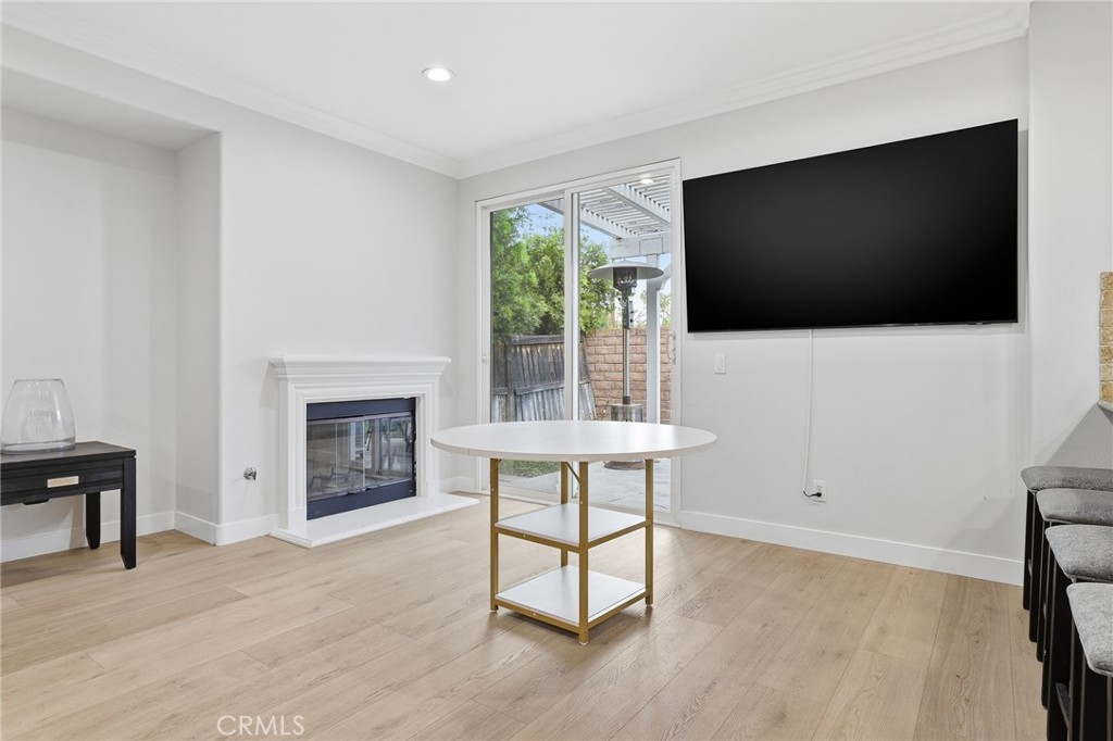 8220 Chamberlain Reseda, CA 91335 - Photo 18 of 46 a living room with furniture a flat screen tv and a fireplace
