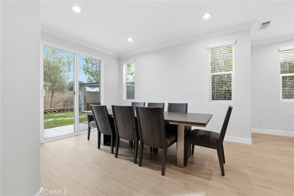 8220 Chamberlain Reseda, CA 91335 - Photo 21 of 46 a view of a dining room with furniture and wooden floor