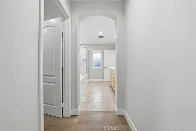 a en suite bathroom with a double vanity sink a mirror and a