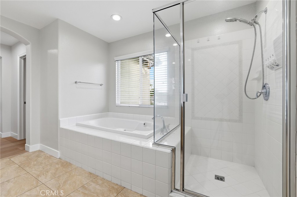 8220 Chamberlain Reseda, CA 91335 - Photo 29 of 46 a bathroom with a bathtub and a shower