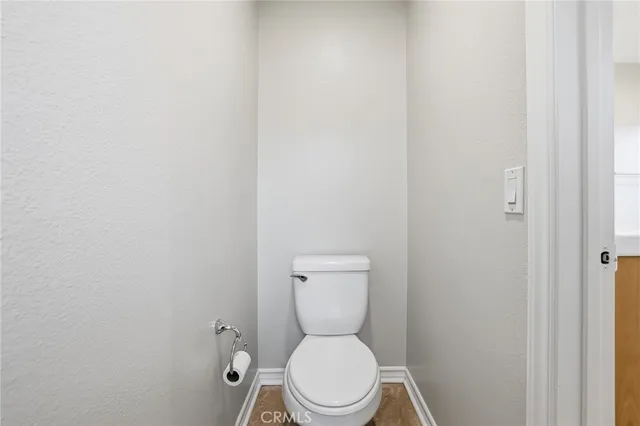 a large bed sitting in a room next to a window