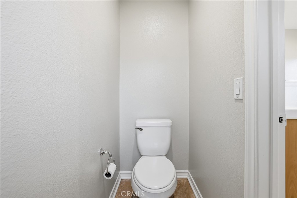 8220 Chamberlain Reseda, CA 91335 - Photo 31 of 46 a white toilet sitting next to a white wall